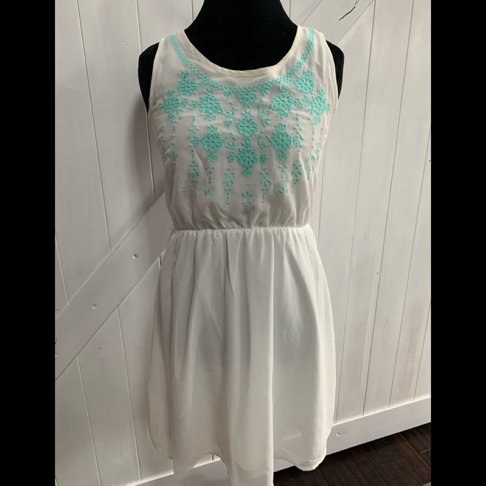 White dress with mint green embroidered work